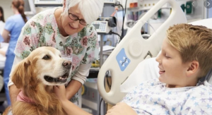 Therapy dog helping child in hospital[2]
